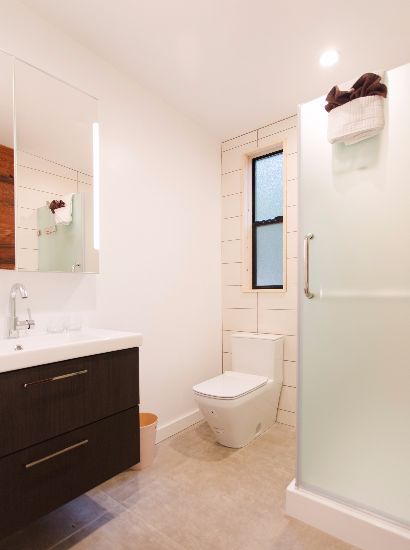 Heated tile floors in bathroom with accessible shower.