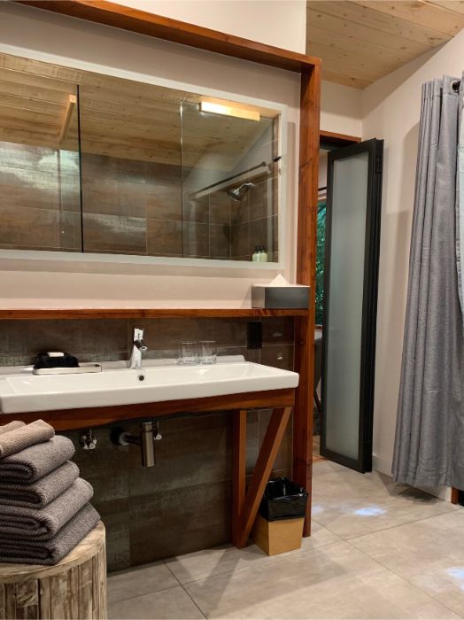 Bathroom with custom walk in shower and luxurious heated tile floor.