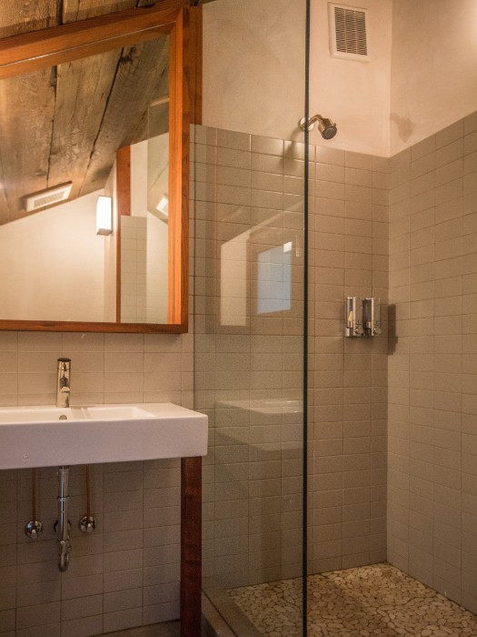 Private bath with walk-in shower and radiant heated flooring.
